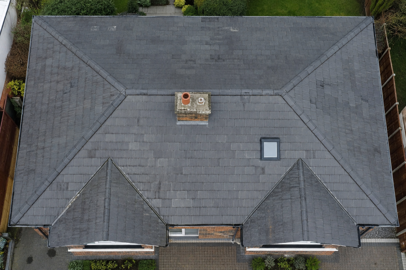 A realistic aerial view of a house roof being inspected